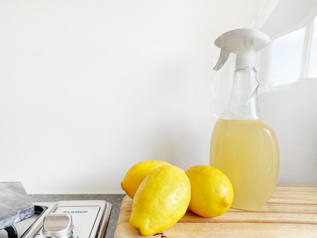 Homemade cleaner made with lemons in a bottle.