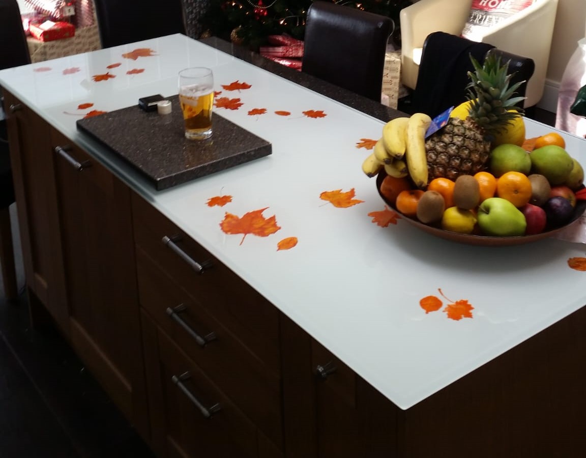 Glass kitchen table top with painted leaves underneath